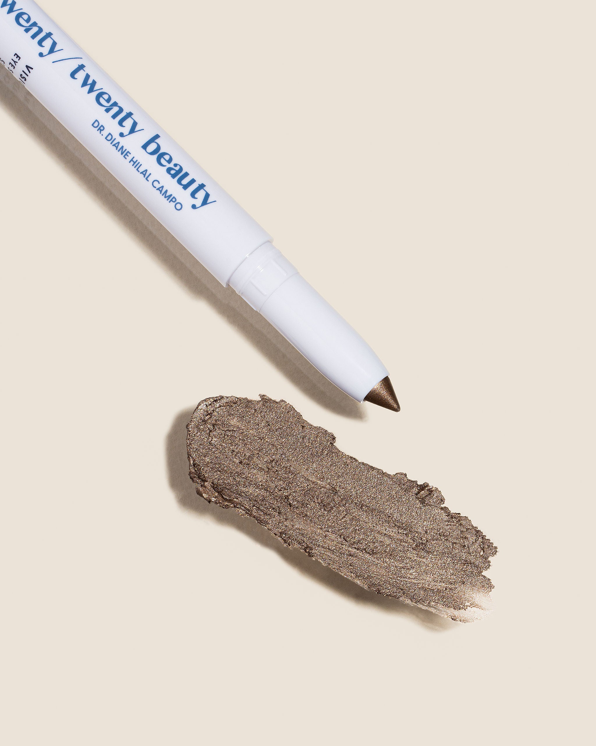 Cream eye shadow stick in shade Love At First for a smokey, grey beige taupe with natural shimmer